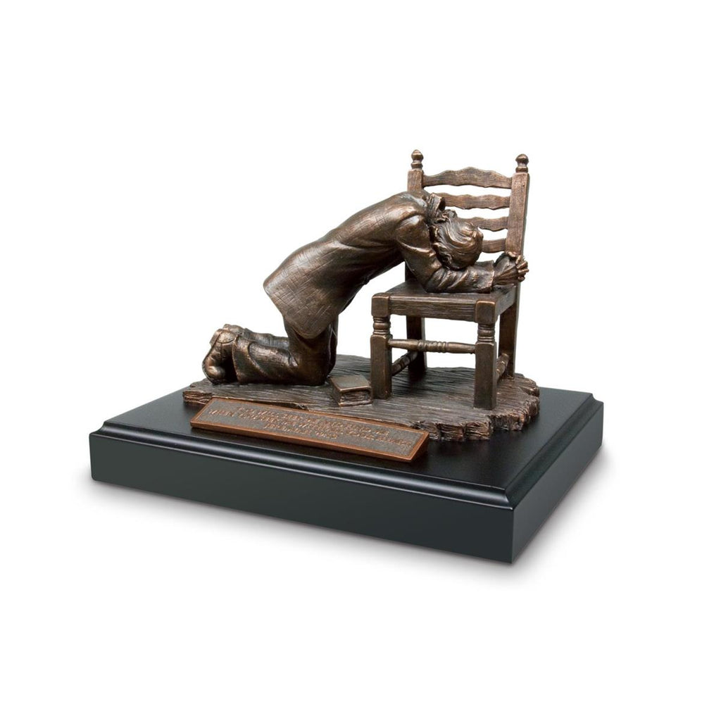Praying Man in Chair Bronze Sculpture